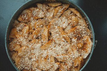 Close-up of raw apple pie in baking dish