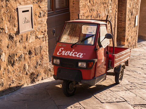 Montalcino, Italy - August 12 2021: Piaggio Ape 50 Mini Car or three wheeled light commercial vehicle.