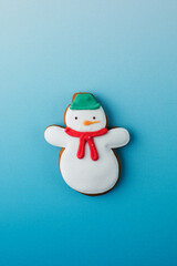 Funny snowman of gingerbread on blue gradient background Christmas banner design