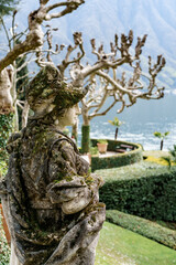 Sculpture of the hunting goddess Diana in the park of Villa Balbianello, Italy