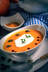 Delicious vegetable pumpkin cream soup with coconut milk