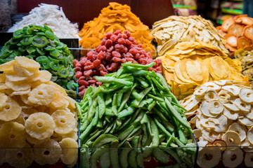 Close up of various of dried fruits at street market in Turkey. Kiwi, pineapple, orange, apple, mango at Egyptian Bazaar, Istanbul