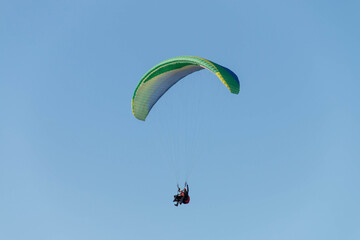 Twin paraglider. Paragliding against the blue sky.