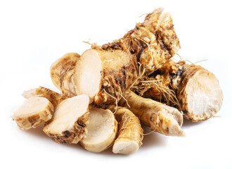 Horseradish roots close up isolated on white background.
