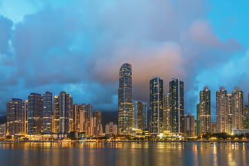 Fototapeta na wymiar Panorama of skyline and Harbor of midtown of Hong Kong city at dusk