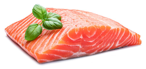 Fresh raw salmon fillet decorated with basil leaves.