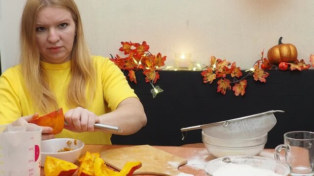 Mam And Daughter Are Making Dough pie For Thanksgiving Pie. put the dough in a mold for a thanksgiving pumpkin pie. Process of making Pumpkin pie for Thanksgiving Day. Seasonal traditional autumn fest