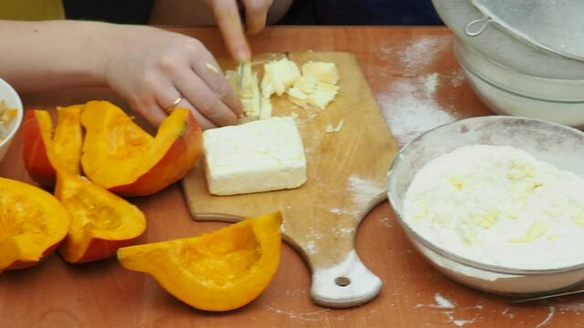 Mam And Daughter Are Making Dough pie For Thanksgiving Pie. put the dough in a mold for a thanksgiving pumpkin pie. Process of making Pumpkin pie for Thanksgiving Day. Seasonal traditional autumn fest