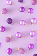 Purple bauble on a purple background. Violet monochromatic aesthetic Christmas and New Year...
