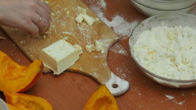 Mam And Daughter Are Making Dough pie For Thanksgiving Pie. put the dough in a mold for a thanksgiving pumpkin pie. Process of making Pumpkin pie for Thanksgiving Day. Seasonal traditional autumn fest