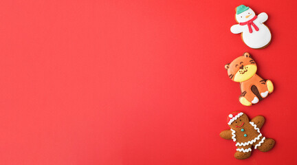 Set of traditional Christmas gingerbread on bright red background party banner. Copy space.