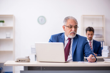 Two male colleagues working in the office