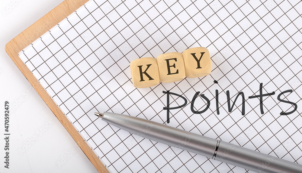 Poster key points text concept written on the wooden cubes blocks and notebook