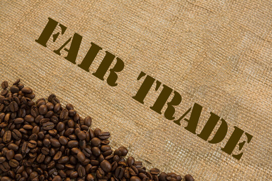 Dark roasted fair trade coffee beans with text Fair Trade