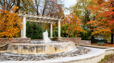 nice landscape with a fountain in an autumn park