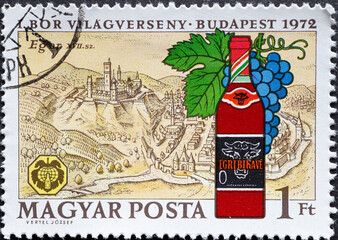 HUNGARY - CIRCA 1972: A post stamp printed in Hungary showing a wine bottle with Egri Bikavér from the Hungarian Wine Regions
