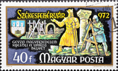 HUNGARY - CIRCA 1972: A post stamp printed in Hungary showing the Prince Géza selecting site of Székesfehervár with coat of arms