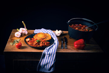 Original Hungarian goulash with potato pancakes