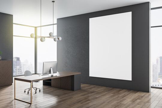 Modern concrete office interior with empty mock up poster on wall, wooden flooring, panoramic bright city view, desk with computer and other pieces of furniture. 3D Rendering.