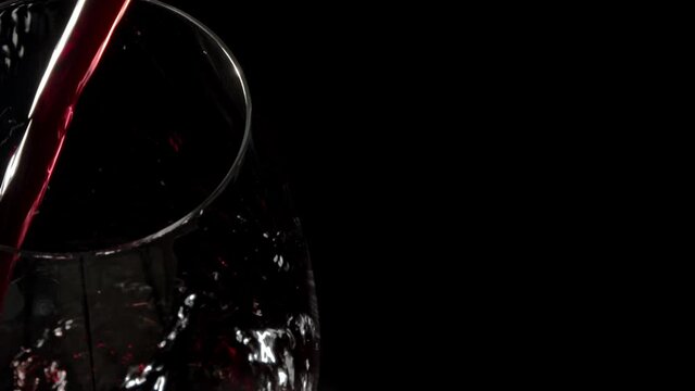 Red Wine Being Poured Into Glass