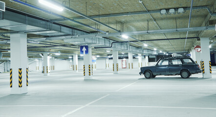 Horizontal image of clean white underground parking lot © strixcode