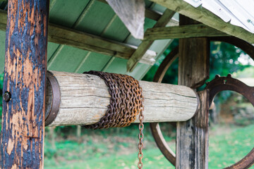 Old water well in a village, abandoned places