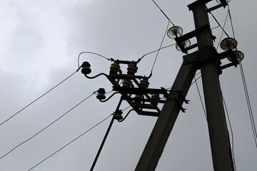 old lines and wires against the white sky