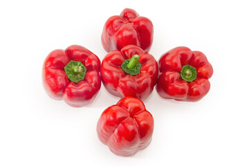 Top view of red bell peppers on a white background