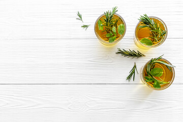 Summer cold tea and fresh herbs rosemary in glasses