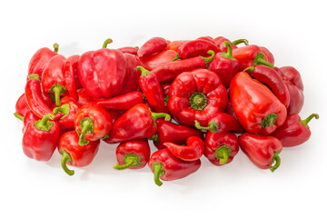 Heap of red bell peppers and chili on white background