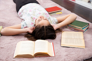 Girl realxed in her romm, without books