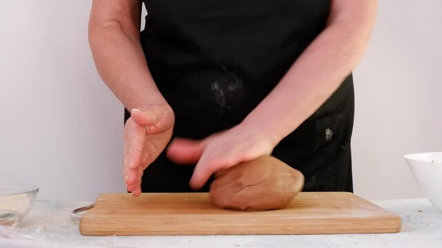 Making homemade gingerbread cookies step by step. DIY concept. Knead the dough well with your hands. Step 11