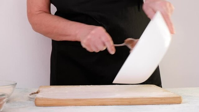 Making homemade gingerbread cookies step by step. DIY concept. Put the dough on a board. Step 10