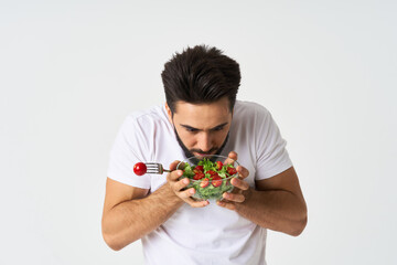 man in white t-shirt plate salad health vegetables