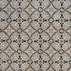 Fragment of building wall with colorful ceramic tiles. Vintage Azulejos, close up. Traditional ornate Portuguese architecture. Abstract background, textured ornate pattern for design or backdrop.
