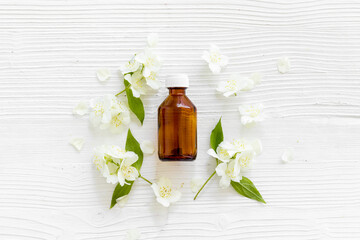 Bottle of fragrant jasmine essential oil. Top view