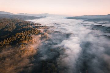 Flying above the clouds sunrise and fog