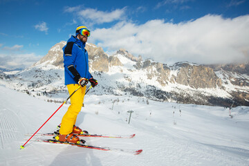 Skier stand on slope in winter mountains - 470614482