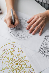 Astrology. Astrologer calculates natal chart and makes a forecast of fate Tarot cards, Fortune...