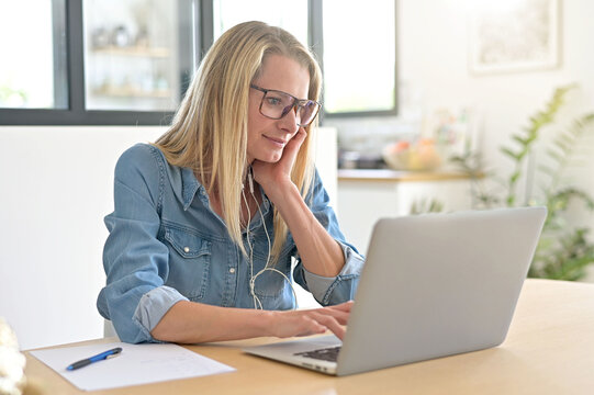 Portrait of 40-year-old blond woman in video-conference