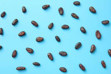 Scattered cocoa beans as background