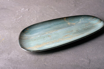 Modern clay dish on a solid background