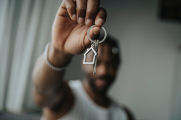 Man holding house key ring