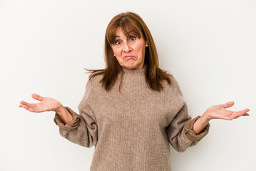Middle age caucasian woman isolated on white background doubting and shrugging shoulders in...