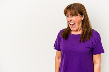 Fototapeta premium Middle age caucasian woman isolated on white background shouting very angry, rage concept, frustrated.