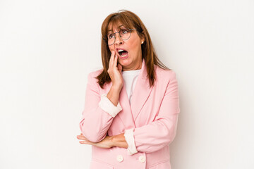 Middle age caucasian woman isolated on white background yawning showing a tired gesture covering mouth with hand.