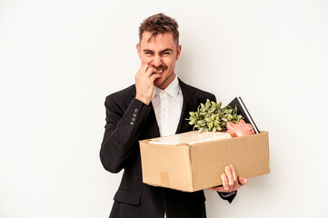 Young caucasian business man fired from job isolated on white background biting fingernails, nervous and very anxious.