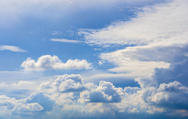 The sky is bright blue with beautiful fluffy clouds. blue sky with clouds