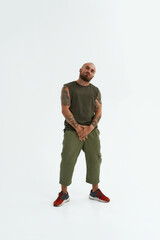 Young cool caucasian man stand and look at camera