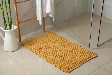 Foto op Plexiglas Soft orange bath mat on floor indoors © New Africa
